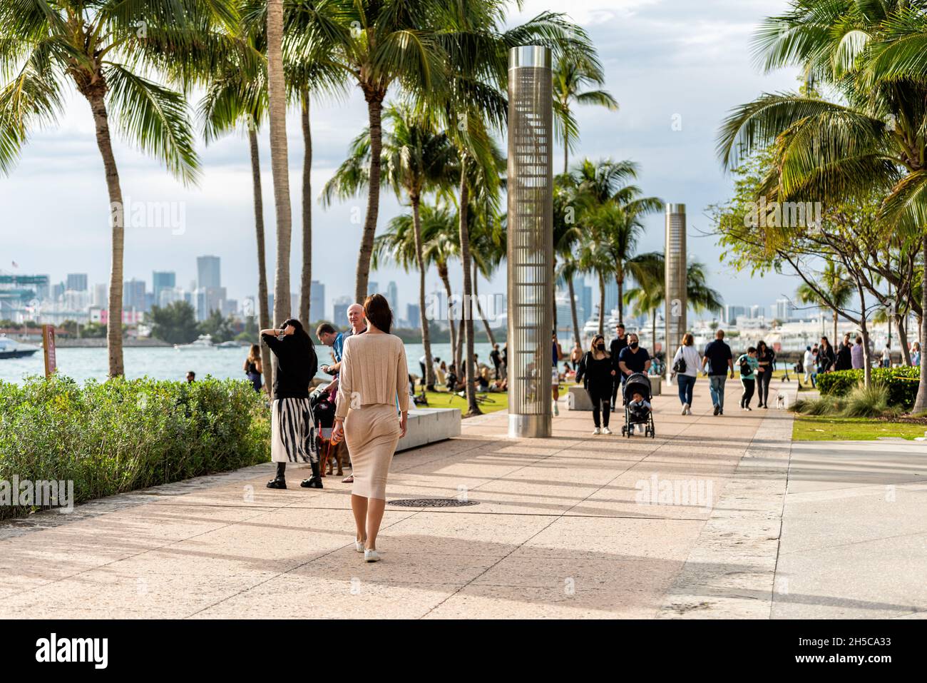Miami Beach, USA January 17, 2021 South Pointe park promenade sidewalk with people walking in