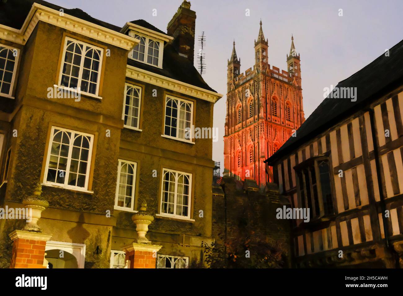 Gloucester, UK. 8th Nov, 2021. The tower of Gloucester Cathedral has been lit with red lights as an act of Remembrance. The 15th century tower is a focal point for people to remember those who have given their lives in previous conflicts. The tower from the courtyards Stock Photo