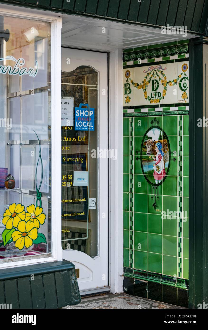 Colourful old fashioned Buttercup Dairy tiles in shop entrance, Dunbar