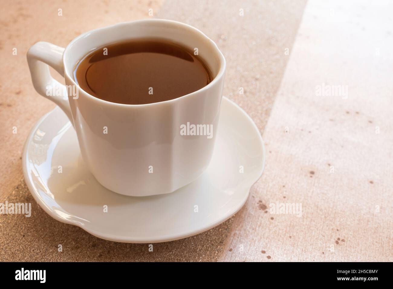 Cup of coffee on table Stock Photo