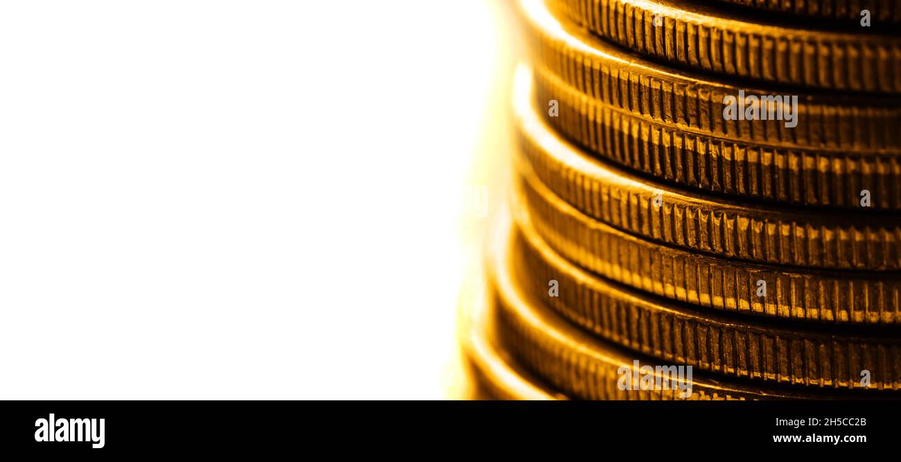 Old gold coins in a stack or pile for money cash representing wealth and riches collection golden Stock Photo
