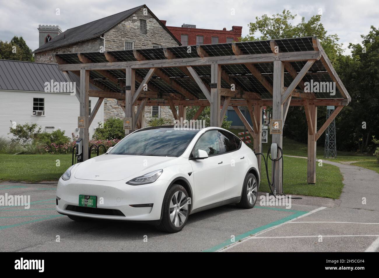 Tesla car at a public electric vehicle charging station in Middlebury