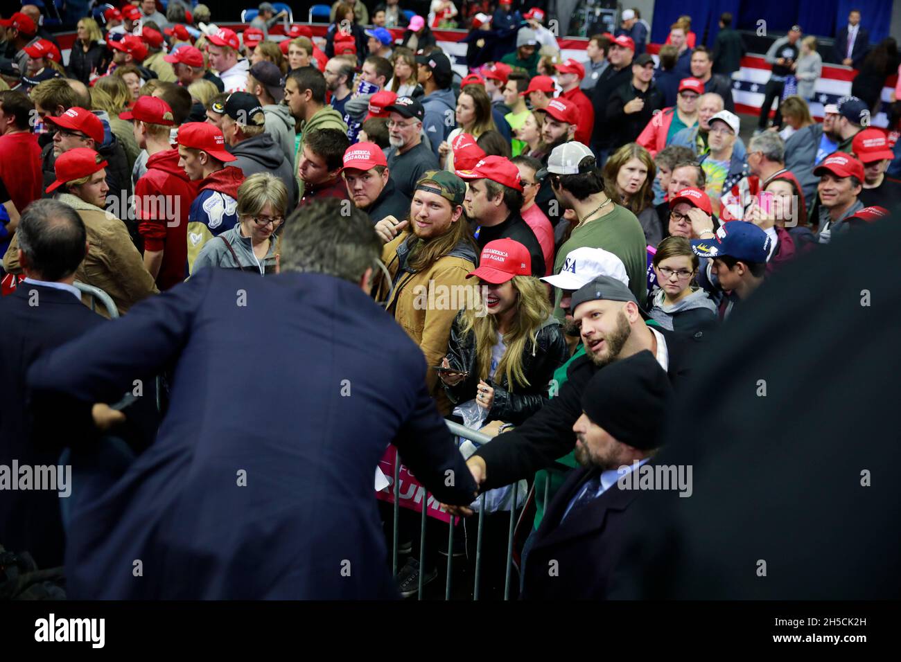 11052018 - Fort Wayne, Indiana, USA: Trump supporters interact with CNN reporter Jim Acosta, some asking for autographs, after United States President Donald J. Trump who is campaigned for Indiana congressional candidates during a Make America Great Again! rally at the Allen County War Memorial Coliseum in Fort Wayne, Indiana. Stock Photo