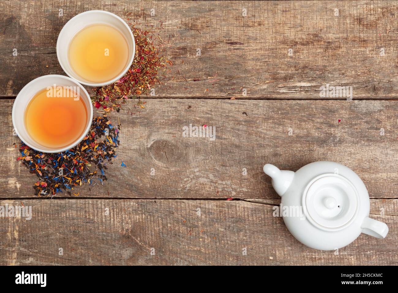Collection of different teas in cups with tea leaves Stock Photo Alamy