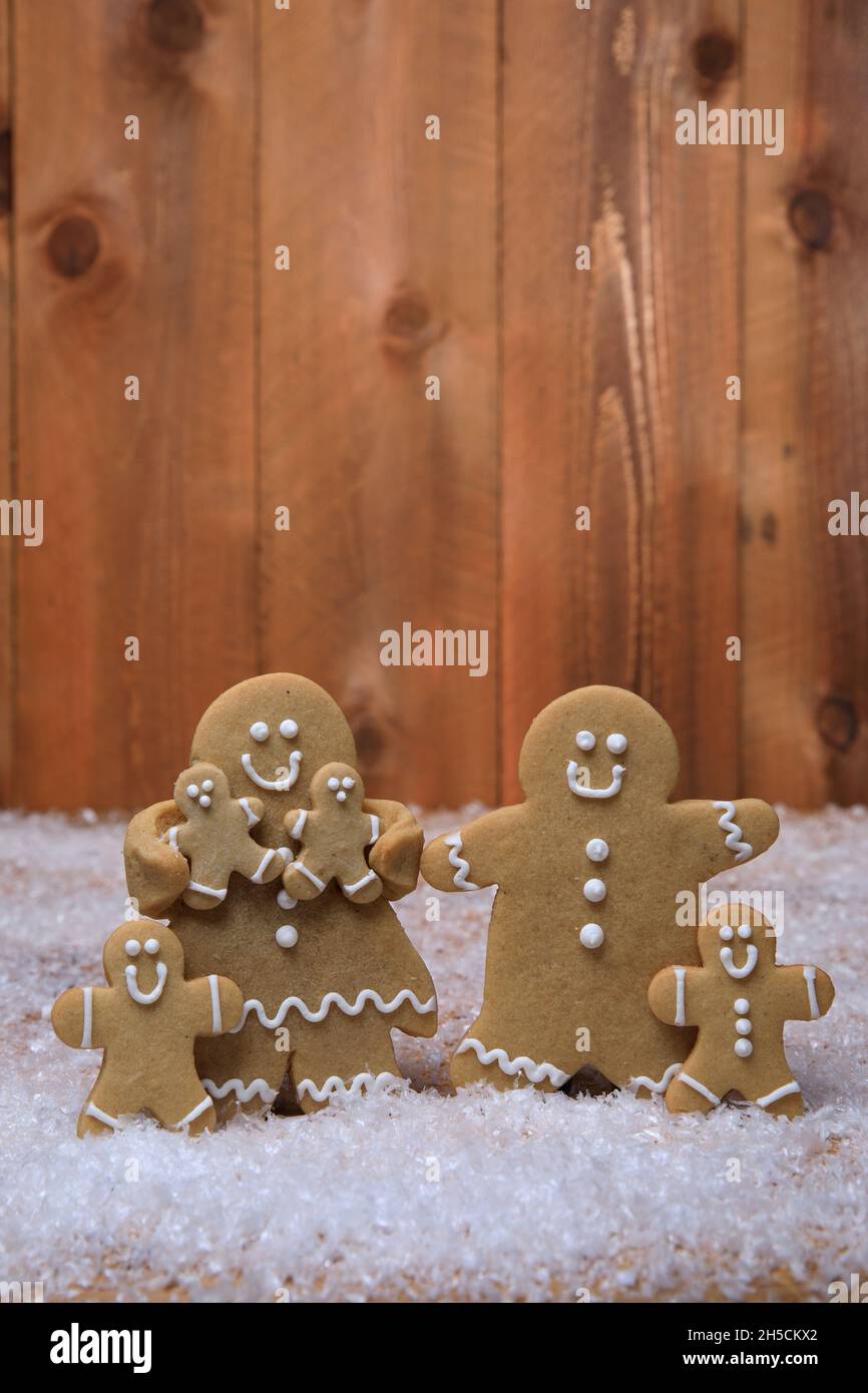 Gingerbread Family of 4 kids on Holiday Christmas Background Stock Photo
