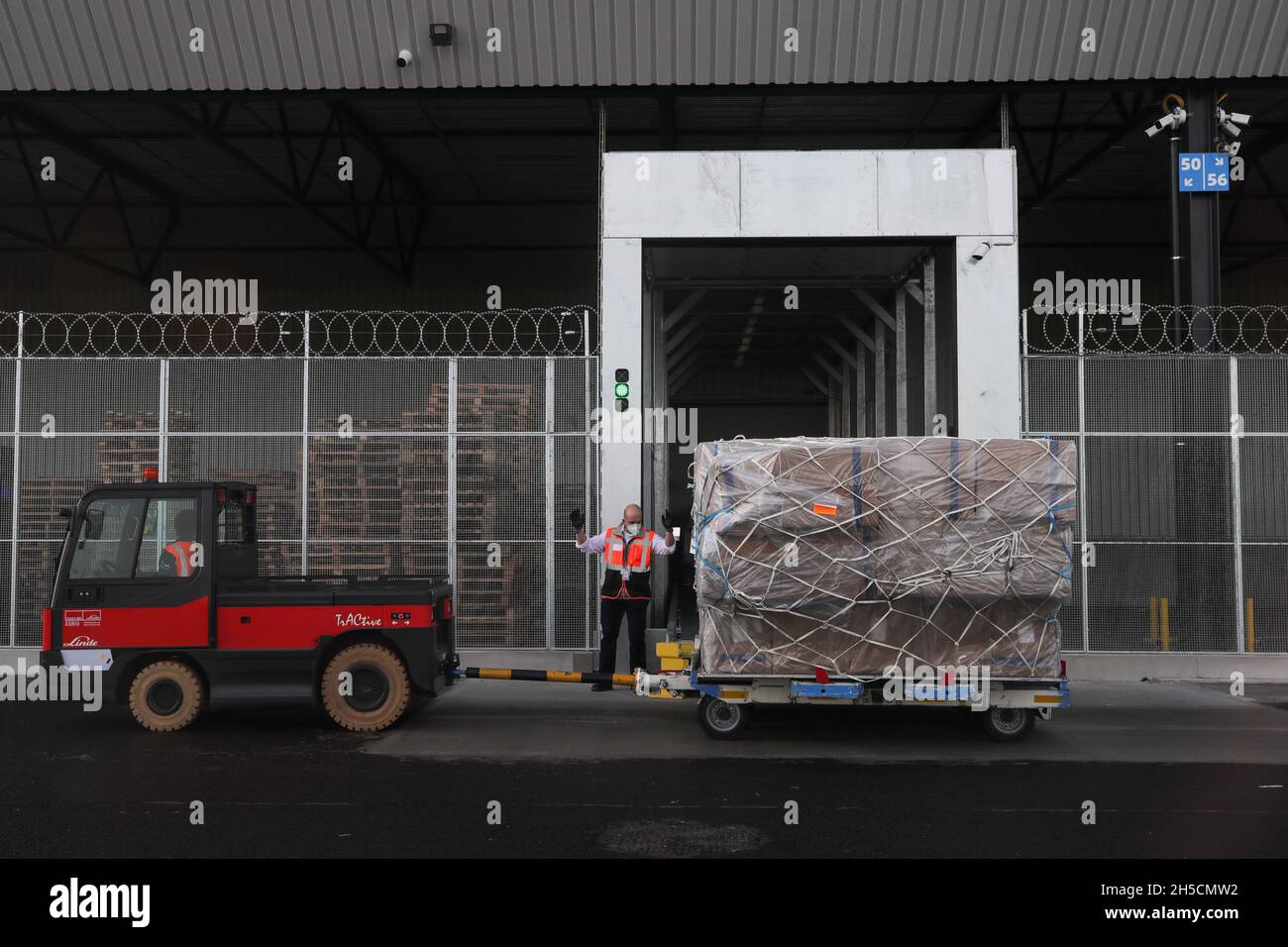 Liege, Belgium. 8th Nov, 2021. People work at Cainiao Network's smart logistics hub at Liege Airport in Grace-Hollogne, Liege Province, Belgium, on Nov. 8, 2021. Cainiao Network, the logistics arm of China's Alibaba Group, officially opened Monday its first smart logistics hub at Liege Airport in Belgium. Credit: Zheng Huansong/Xinhua/Alamy Live News Stock Photo