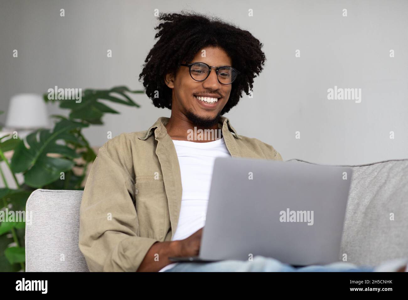 Young black guy using hi-res stock photography and images - Alamy