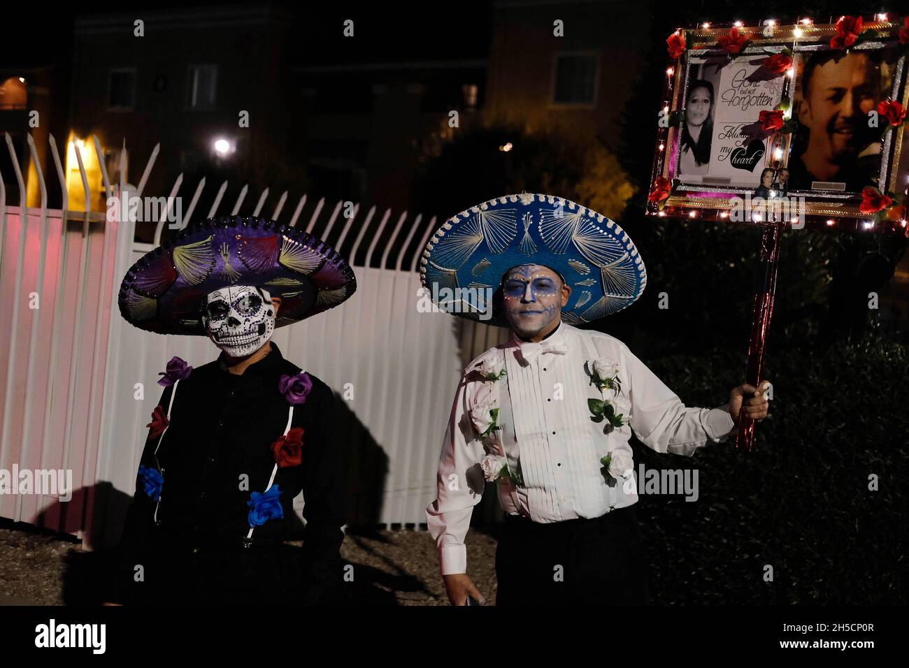 Tucson, Arizona, USA. 7th Nov, 2021. The 32nd annual All Souls Procession in Tucson. Put on by the organization Many Mouths One stomach it is a chance for the public to come together and remember relatives, friends and loved ones who have passed on . Tens of thousands turn out with pictures of the deceased, dressed in ornate costumes and carrying shrines . It looks similar to Mexico's Day of the Dead but is not part of that celebration. People leave messages for their loved ones that are collected by costumed ushers who place the notes in a giant urn that is carried through the streets Stock Photo