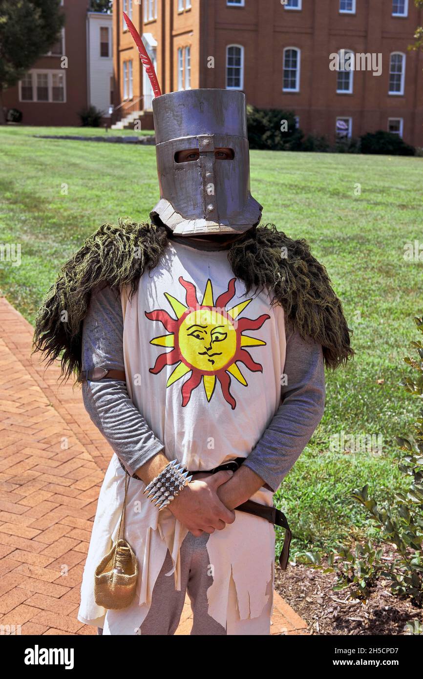 A participant displays their medieval knight costume during the 2021