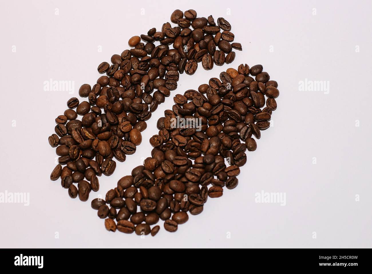 Top view of fresh roasted brown aromatic coffee beans isolated on a ...