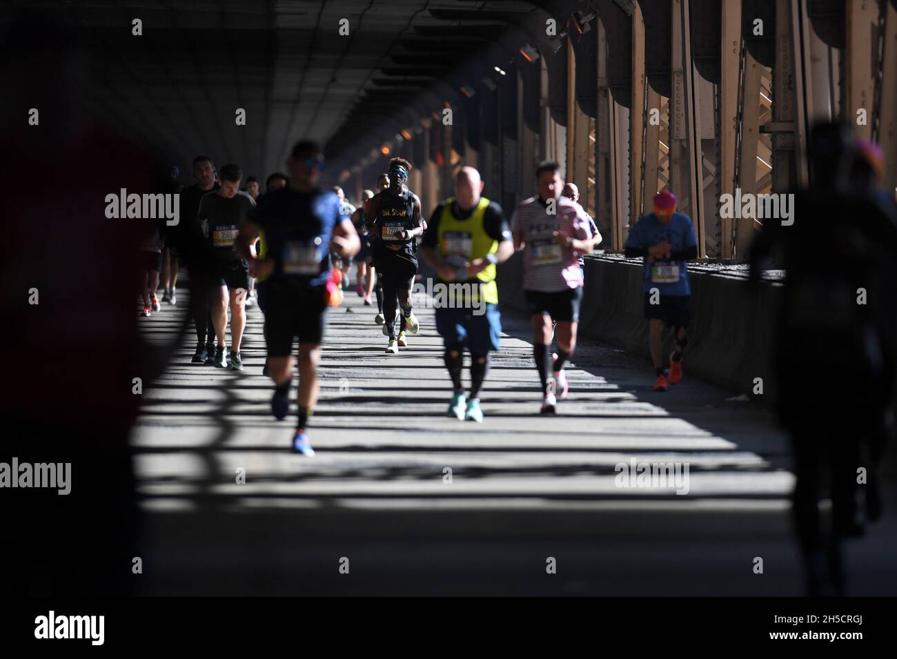 Runners are seen racing on the 59th Street Bridge during the 2021 TCS