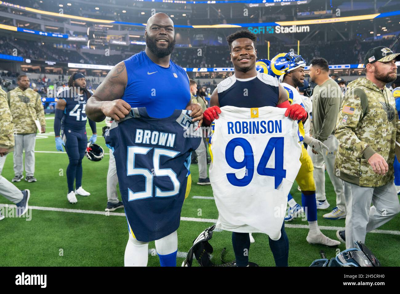 Los Angeles Rams defensive tackle A'Shawn Robinson (94) and Tennessee Titans inside linebacker Jayon Brown (55) exchange jerseys after a NFL game, Sun Stock Photo