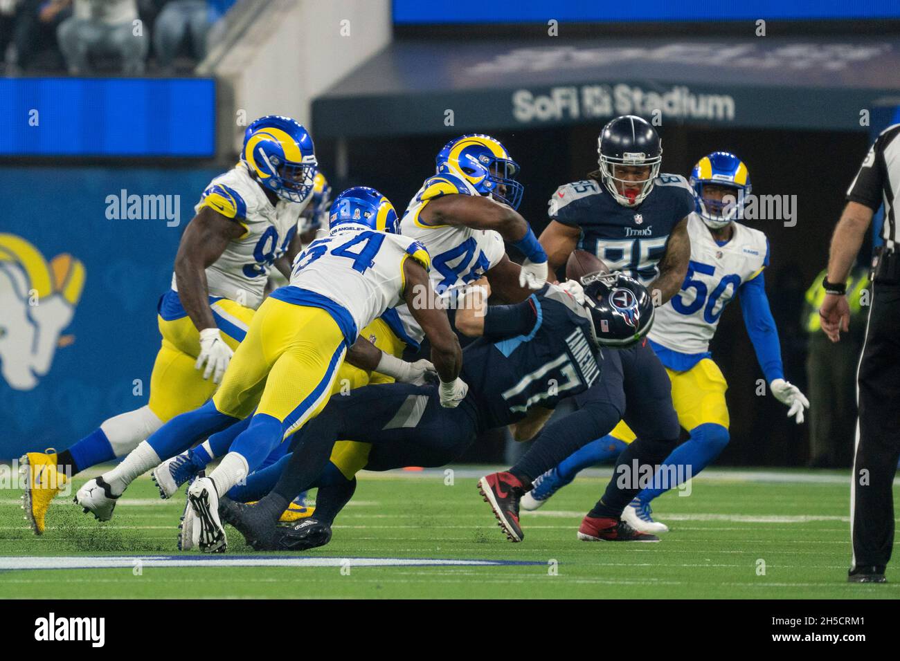 Los Angeles Rams linebacker Obo Okoronkwo (45) is called for roughing the passer against Tennessee Titans quarterback Ryan Tannehill (17) during a NFL Stock Photo