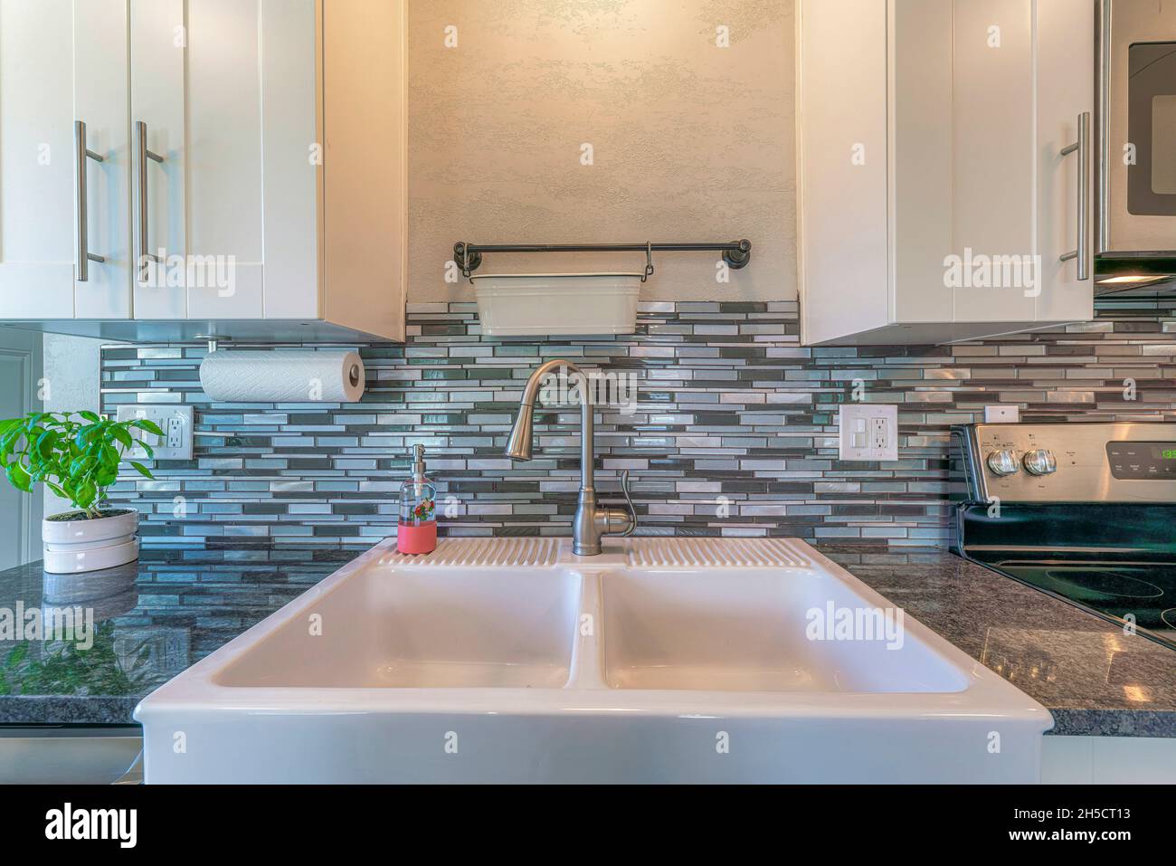 Ceramic double sink with single handle faucet in a kitchen Stock Photo ...
