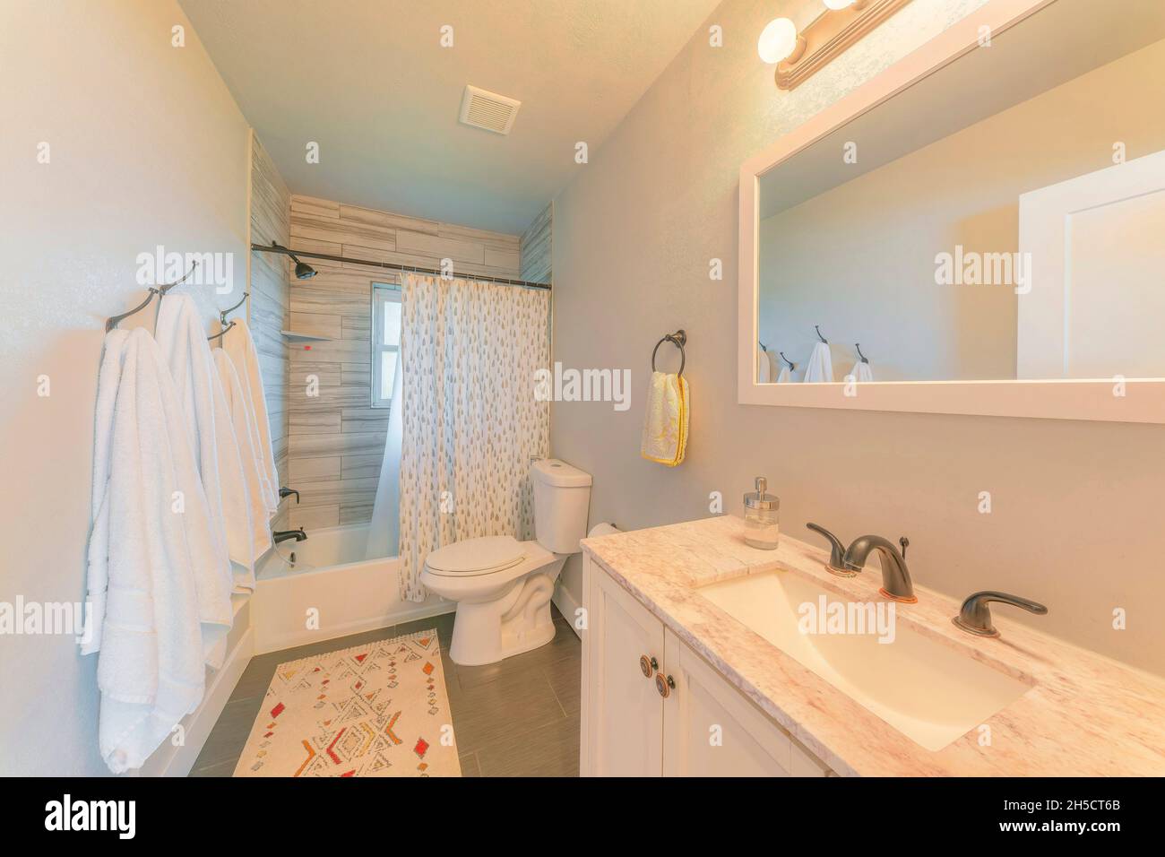 Bathroom interior with window and warm ambient lighting Stock Photo - Alamy