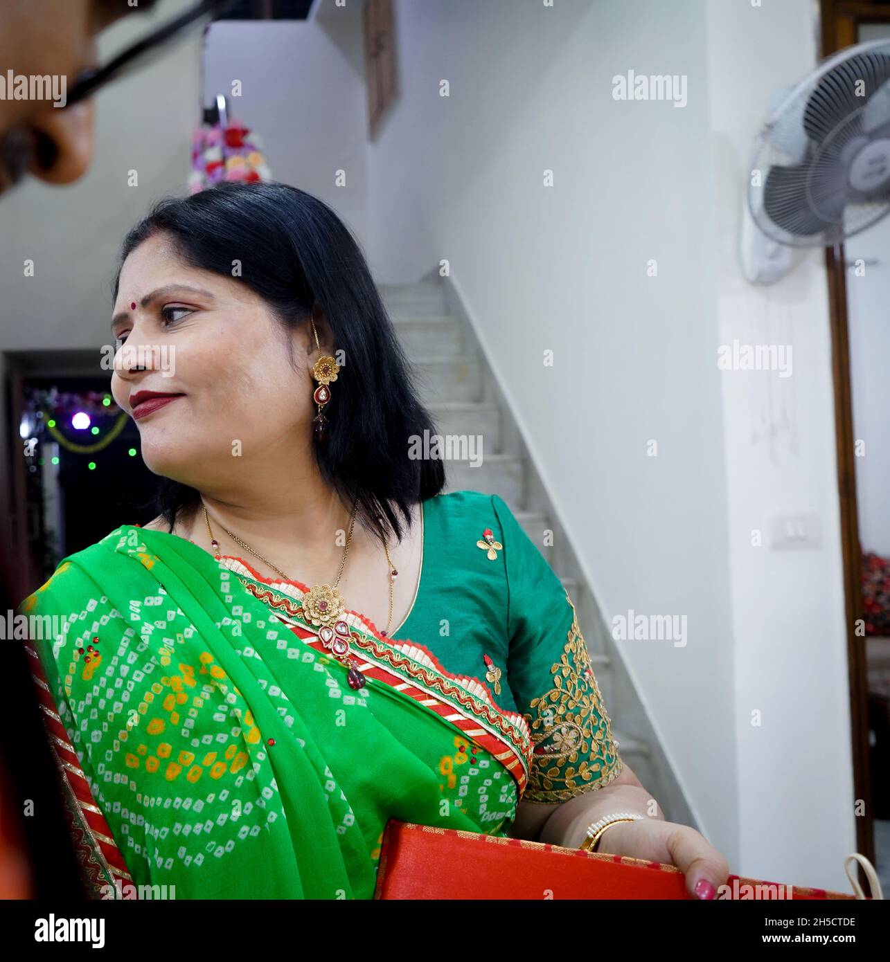 Portrait of an Indian female in a bright green saree Stock Photo - Alamy
