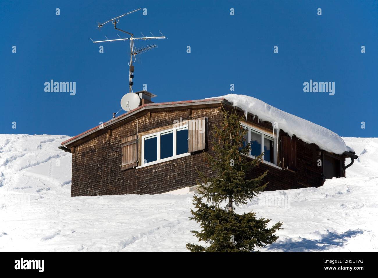 snow-covered ski hut on slope, Germany, Bavaria Stock Photo
