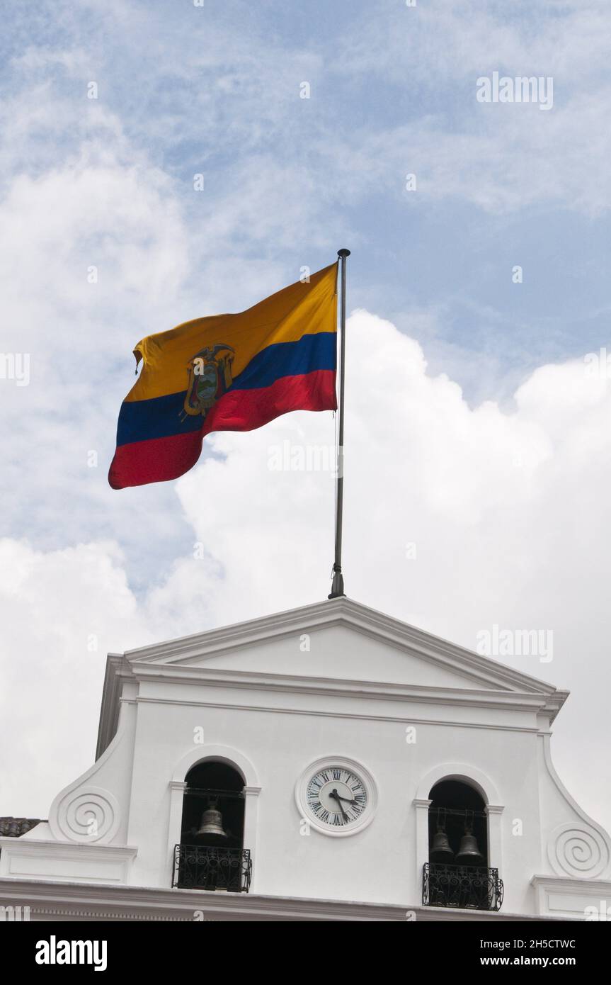 National flag on Presidential Palace blows in the wind, Plaza de Independencia, Historic Center, Ecuador Stock Photo