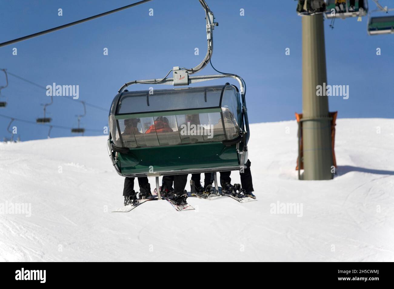 skiers in a chair lift, rear view, Germany, Bavaria Stock Photo