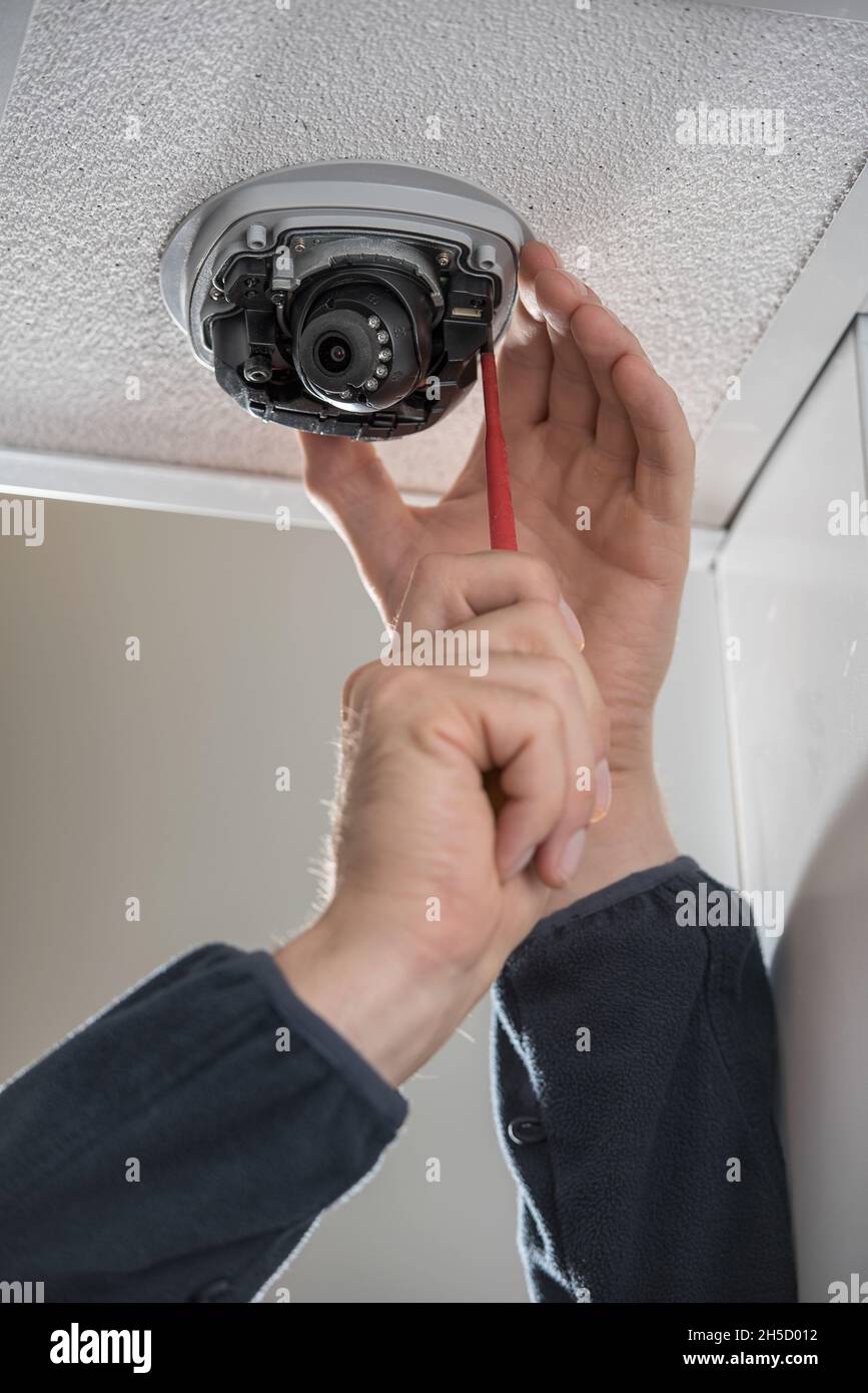 CCTV camera Installation/Repair Stock Photo