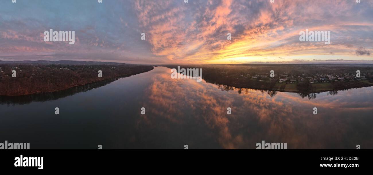 Beautiful panoramic photo of a sunset above a reservoir Stock Photo