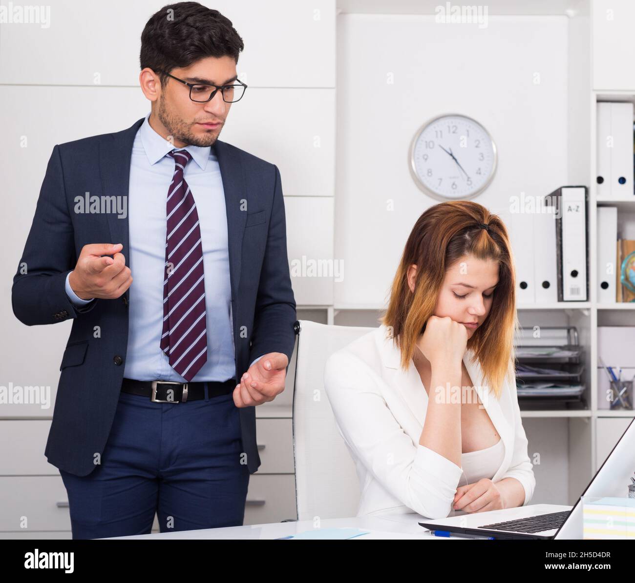 Manager scolding frustrated female Stock Photo