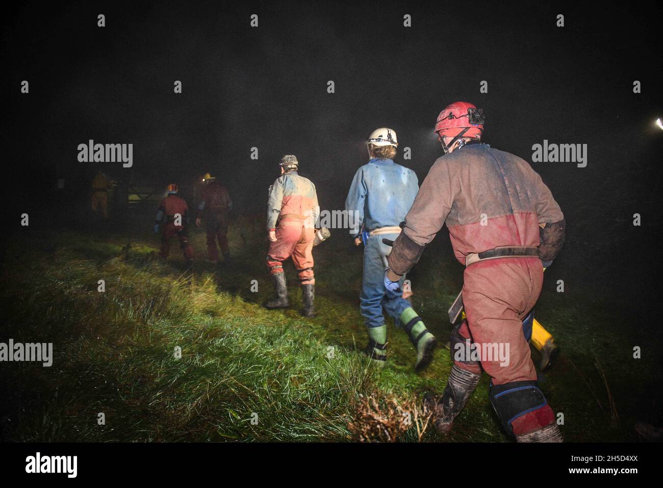 Members of the rescue team head towards the cave in the Penwllt area of ...
