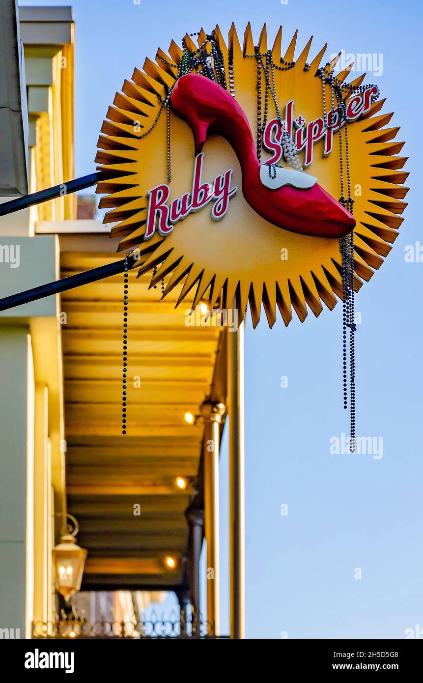 Mardi Gras beads hang from the Ruby Slipper Cafe sign, Nov. 6, 2021, in Mobile, Alabama. Stock Photo