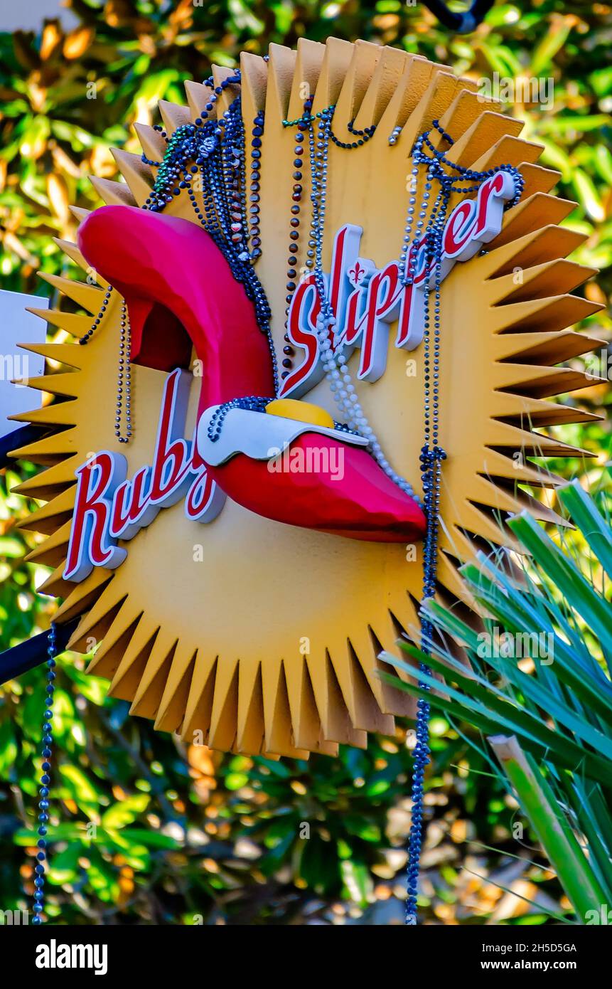 Mardi Gras beads hang from the Ruby Slipper Cafe sign, Nov. 6, 2021, in Mobile, Alabama. Stock Photo