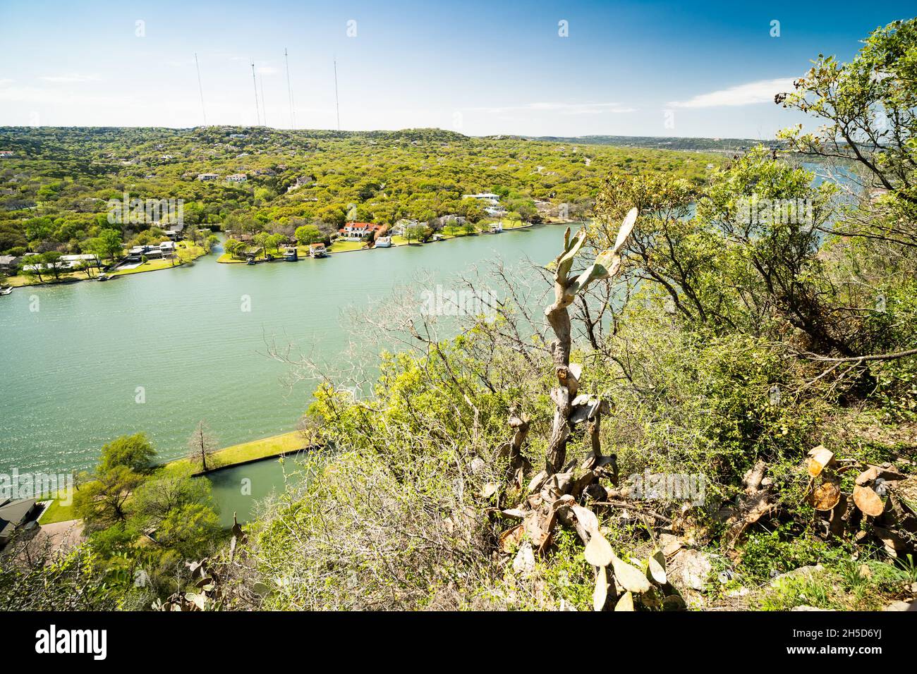 Colorado River in Austin Texas with Big Houses on the Waterfront and Boat Houses Stock Photo