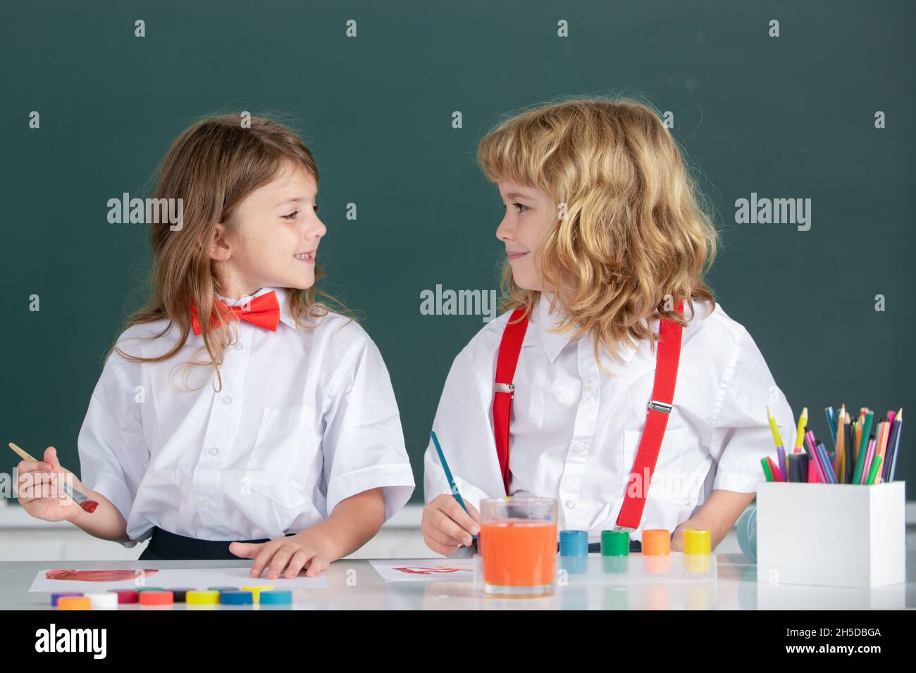 Children Girl And Boy Drawing With Coloring Pens Cute School Kids Painting In Class At School Painting Lesson Drawing Art Best Children Friends Stock Photo Alamy