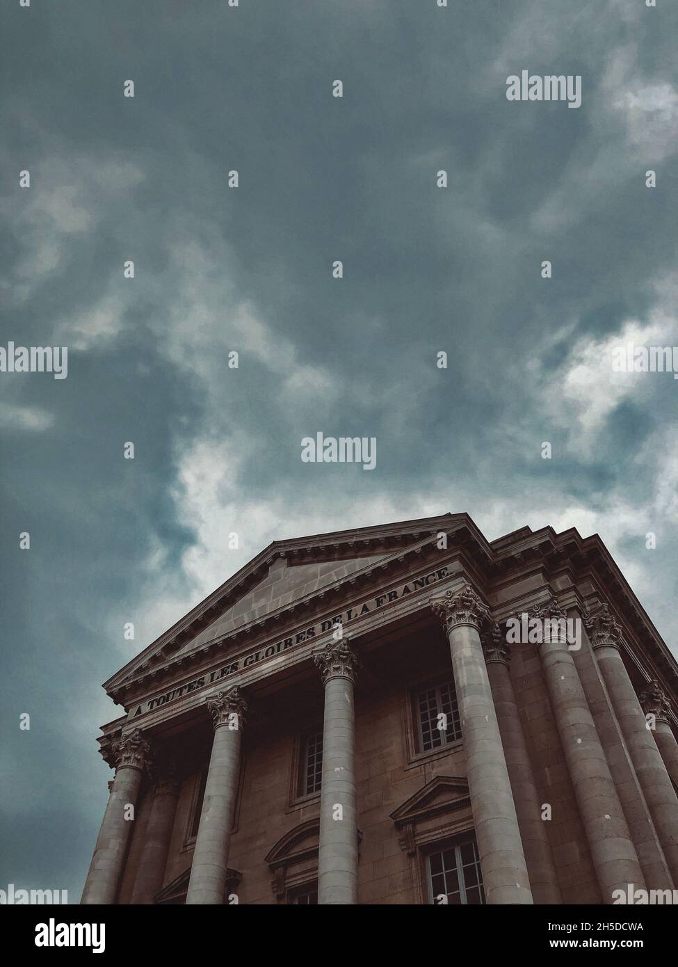 Low angle shot of a modern building under the cloudy skies Stock Photo ...