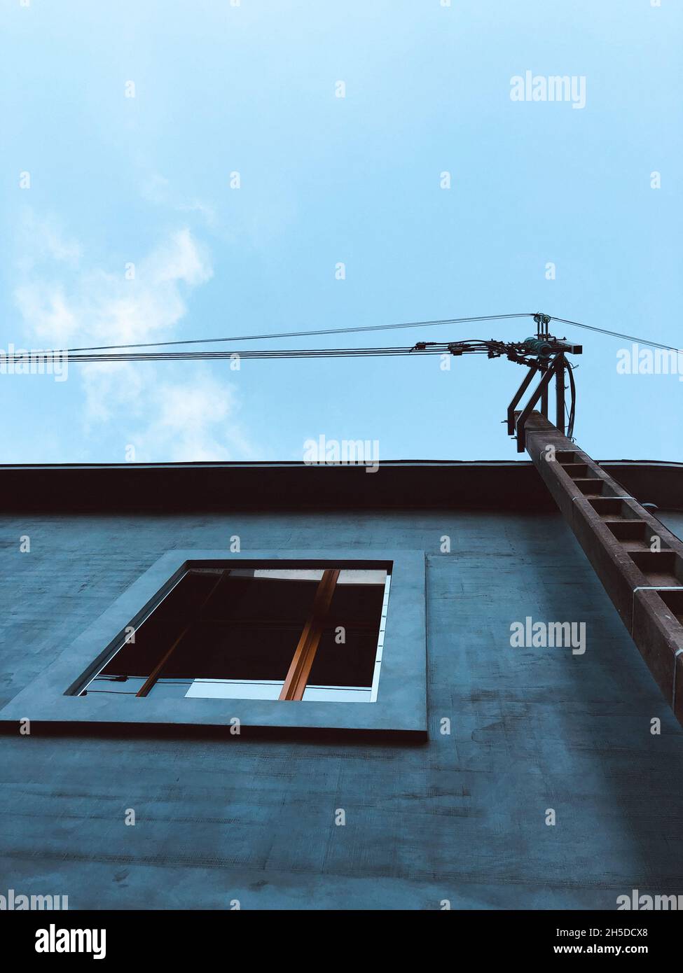 Low angle shot of a modern building under the cloudy skies Stock Photo ...