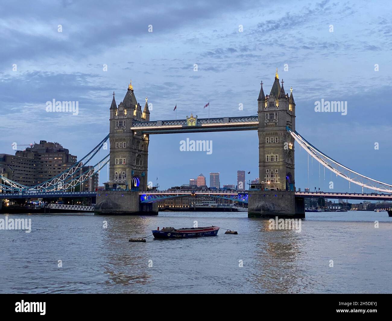 LONDON, UNITED KINGDOM - Aug 14, 2021: A beautiful view of the Tower Bridge, London, UK under the cloudy blue sky Stock Photo