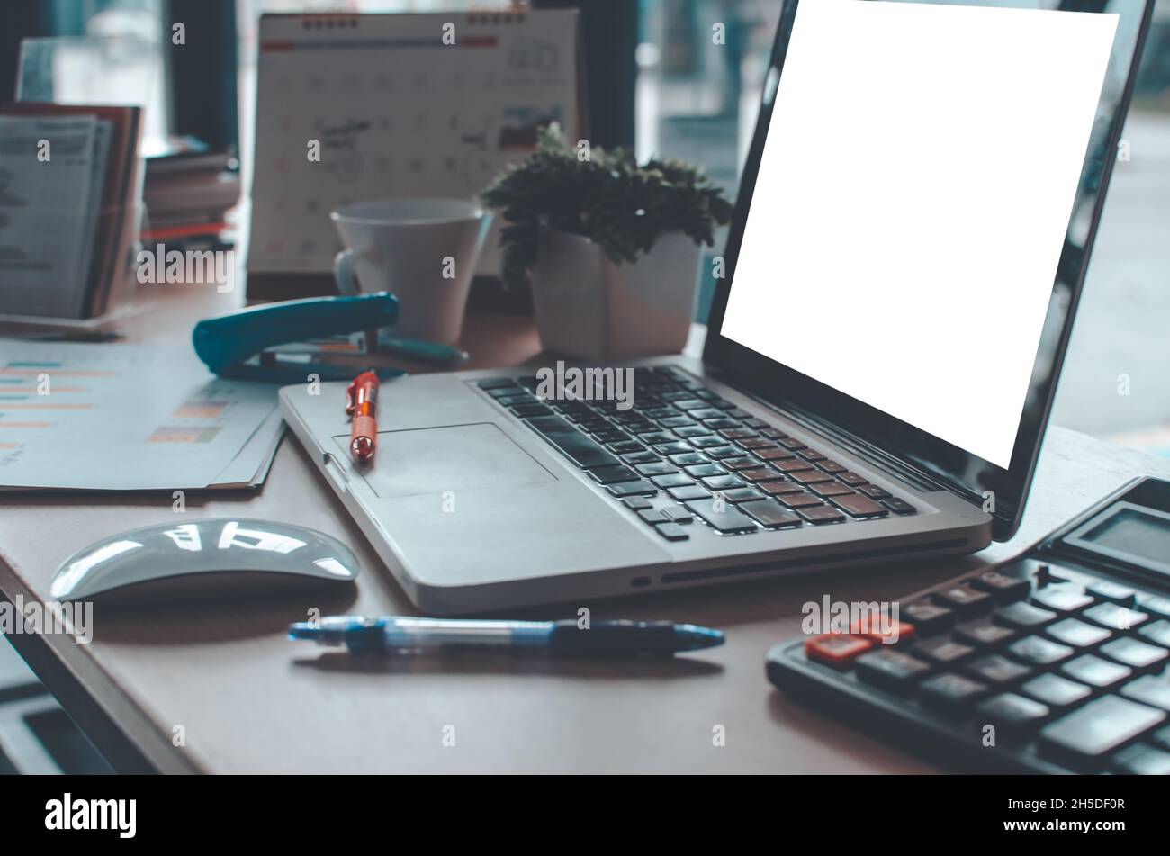 laptop with blank white screen on vintage wooden table Stock Photo - Alamy