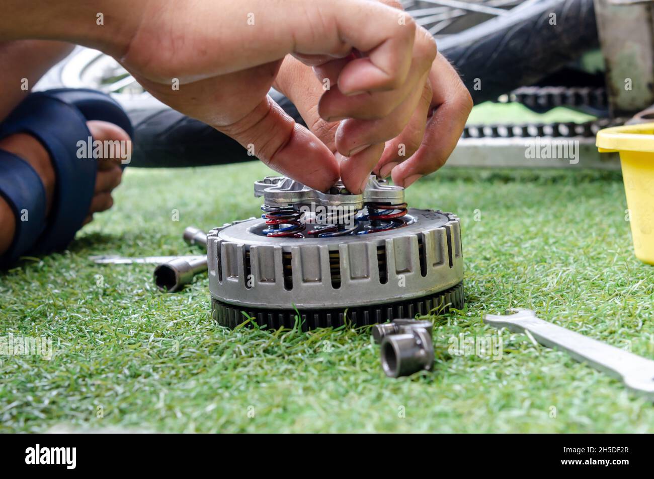 Mechanic repairing a motorcycle engine Stock Photo Alamy