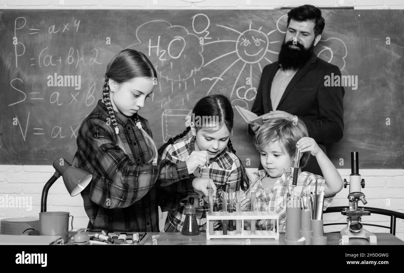 doing experiments with liquids in chemistry lab. chemistry lab. happy