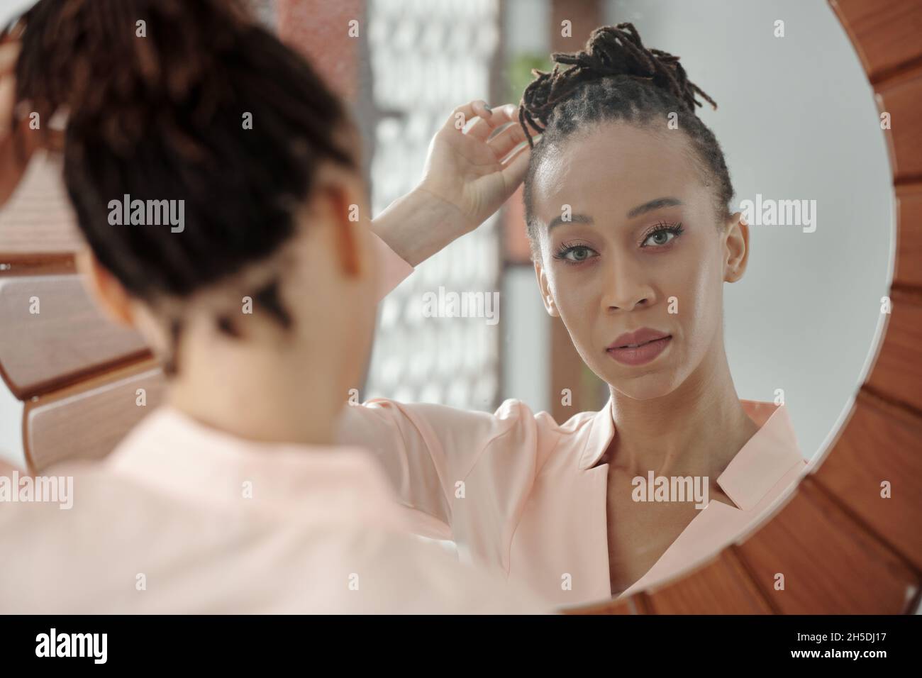 Woman in loungewear hair bun hi-res stock photography and images - Alamy