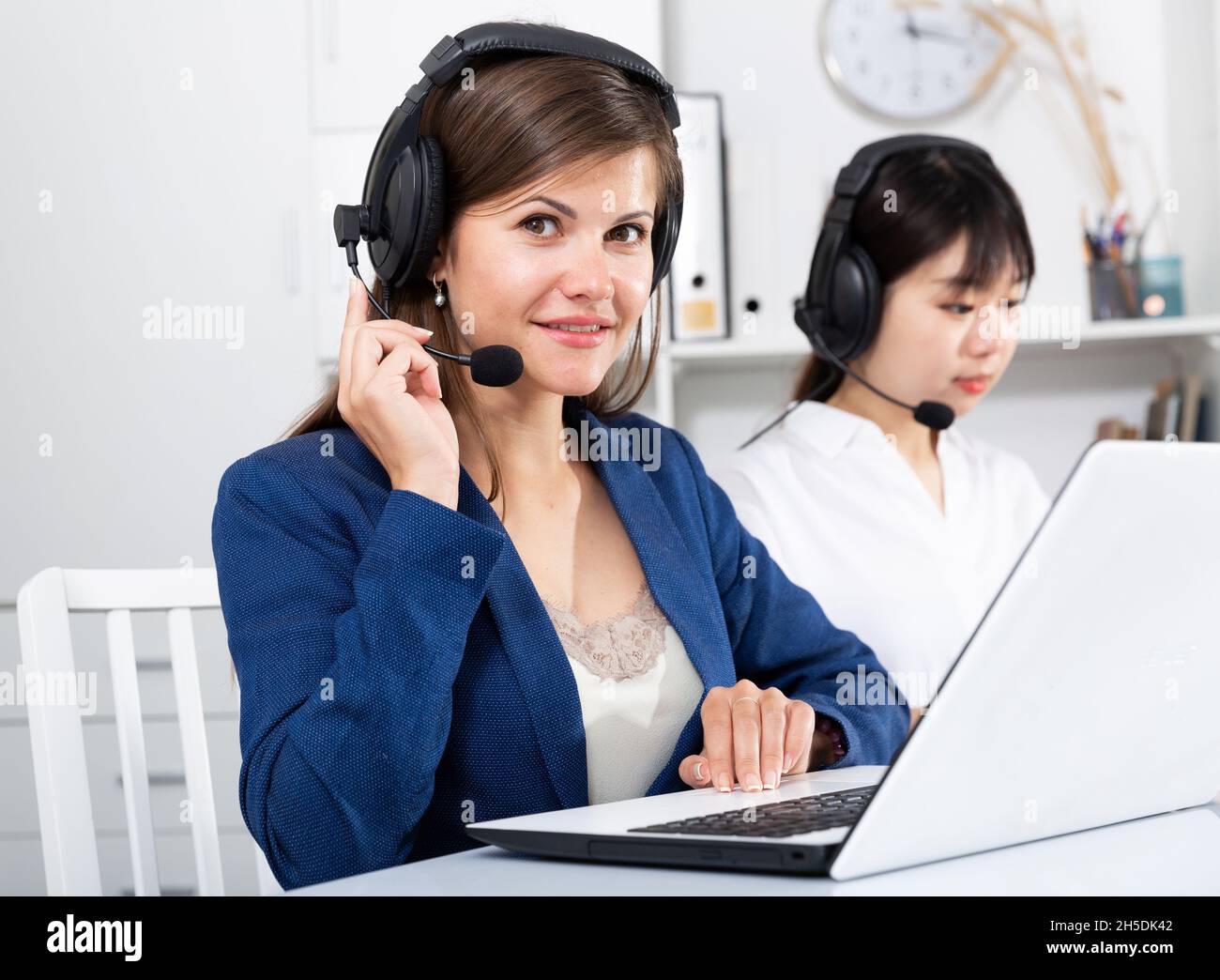 Operators working with computers in an office Stock Photo