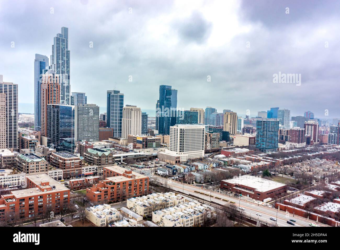 Ariel city view in Chicago of nondescript buildings near Lake Michigaan, showing an overcast Moody sky. Stock Photo