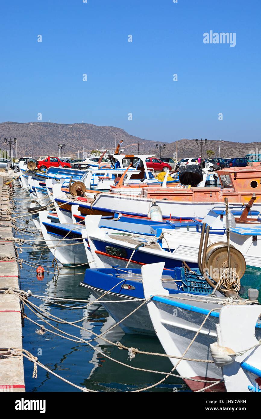 The fronts of a row of traditional fishing boats in the harbour, Elounda, Crete, Greece, Europe. Stock Photo