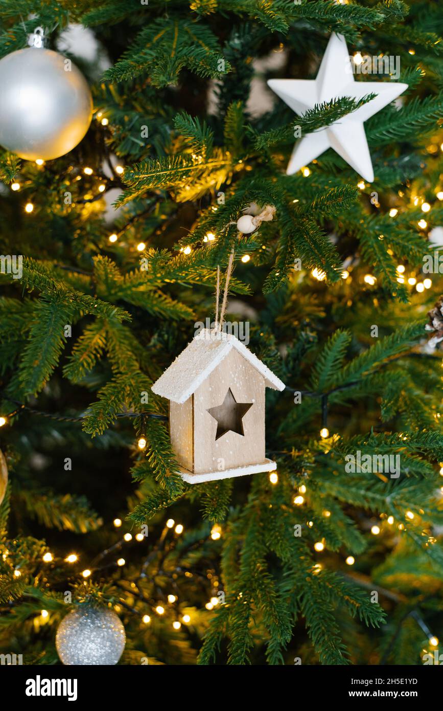 Wall texture decorated with garlands and green pine spruce branches and ...