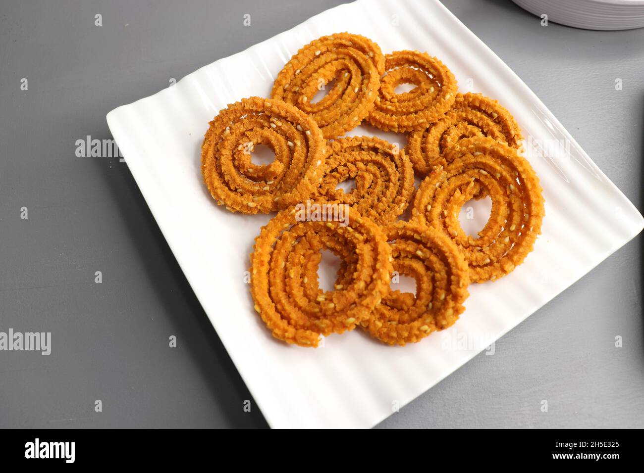 Indian festival food - Diwali Special sweet and salty snacks such as, Chakli, rava laddu, besan ladu, poha chivda, and corn mixture, Namkeen snacks. Stock Photo