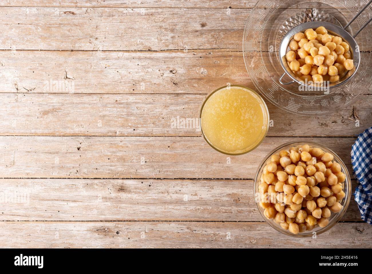 Chickpea water aquafaba on wooden table. Chickpea water is a substitute