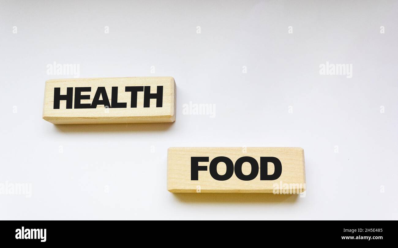 The word HEALTHY FOOD made from wooden blocks on a white background. Healthy food concept Stock Photo