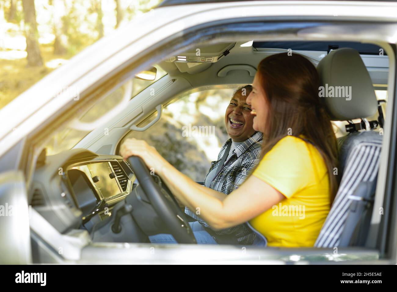 Diverse traveling women in car Stock Photo