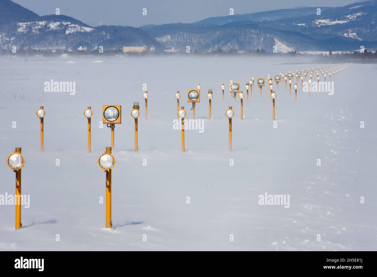 Landing lights on a runway in winter Stock Photo