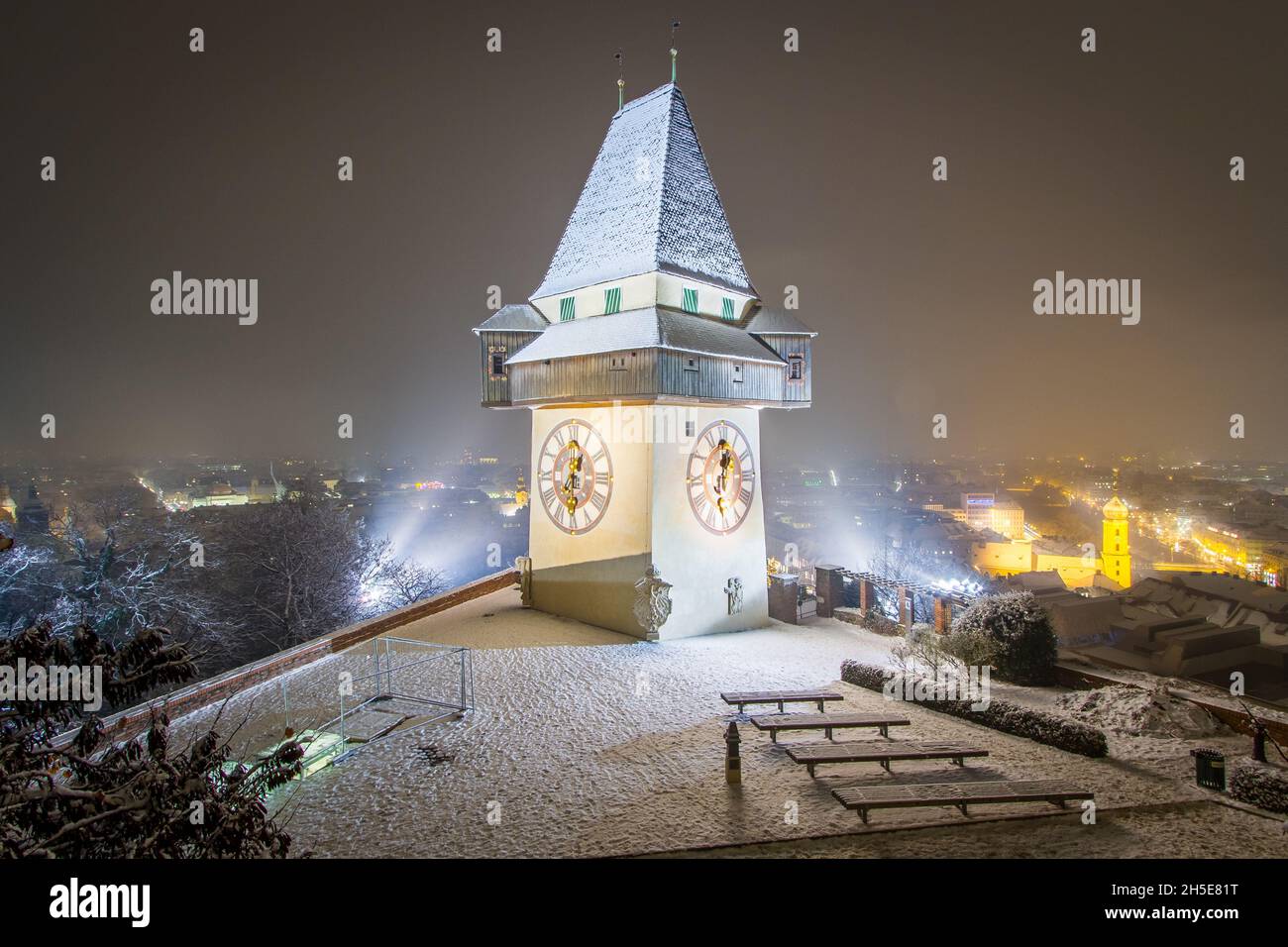 The famous landmark of Graz in a cold and dark winter night with some snow Stock Photo