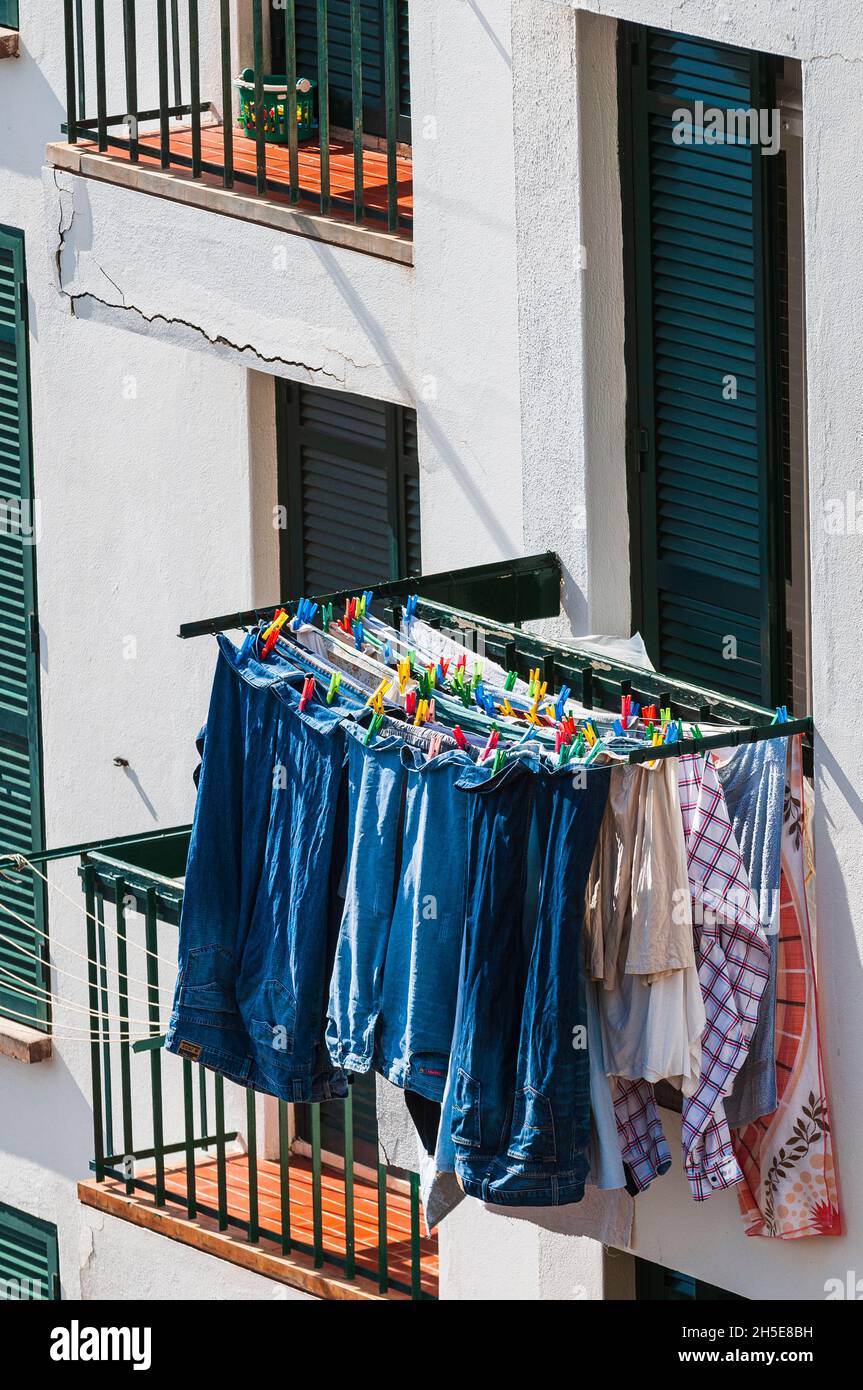 Clothes hanging to dry outside balcony Stock Photo Alamy