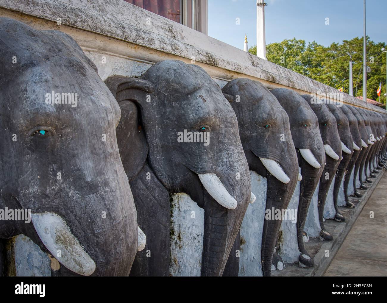 Anuradhapura, Sri Lanka - 13th January 2020: Carved elephants surround the Ruwanwelisaya Stupa Stock Photo